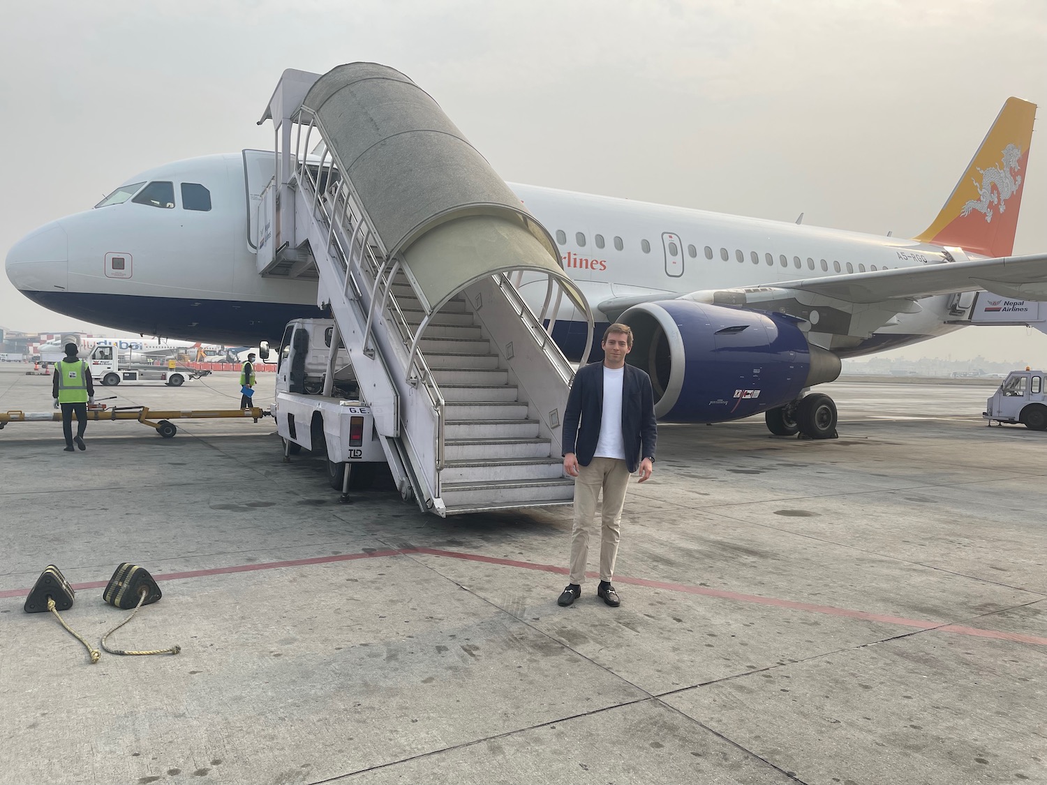 a man standing in front of a plane