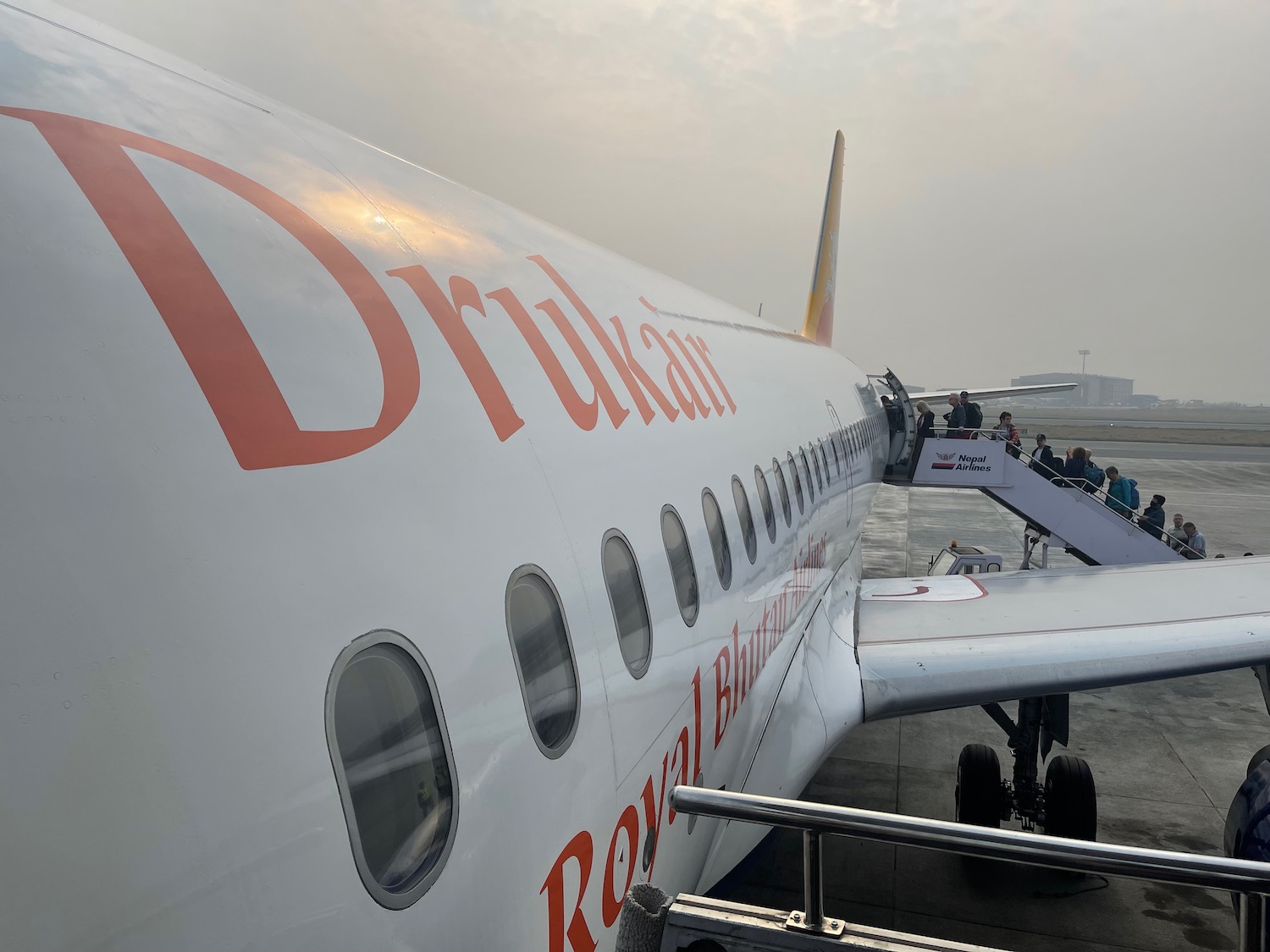 a plane with people boarding