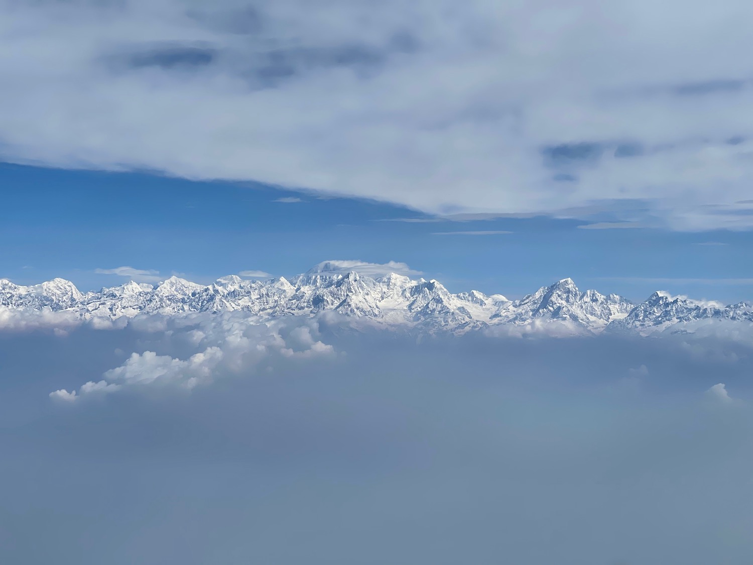 a mountain range with clouds