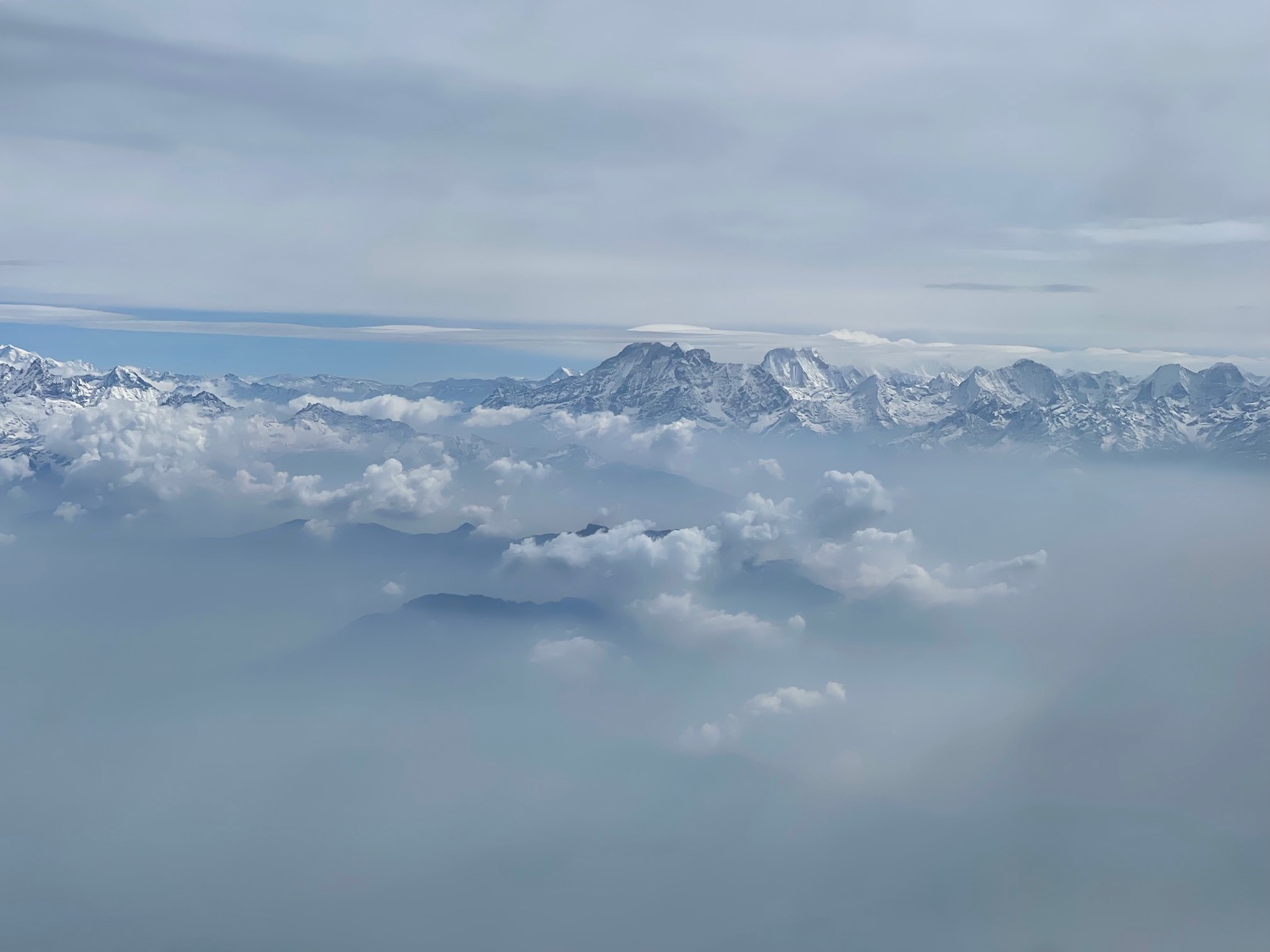 a mountain range with clouds