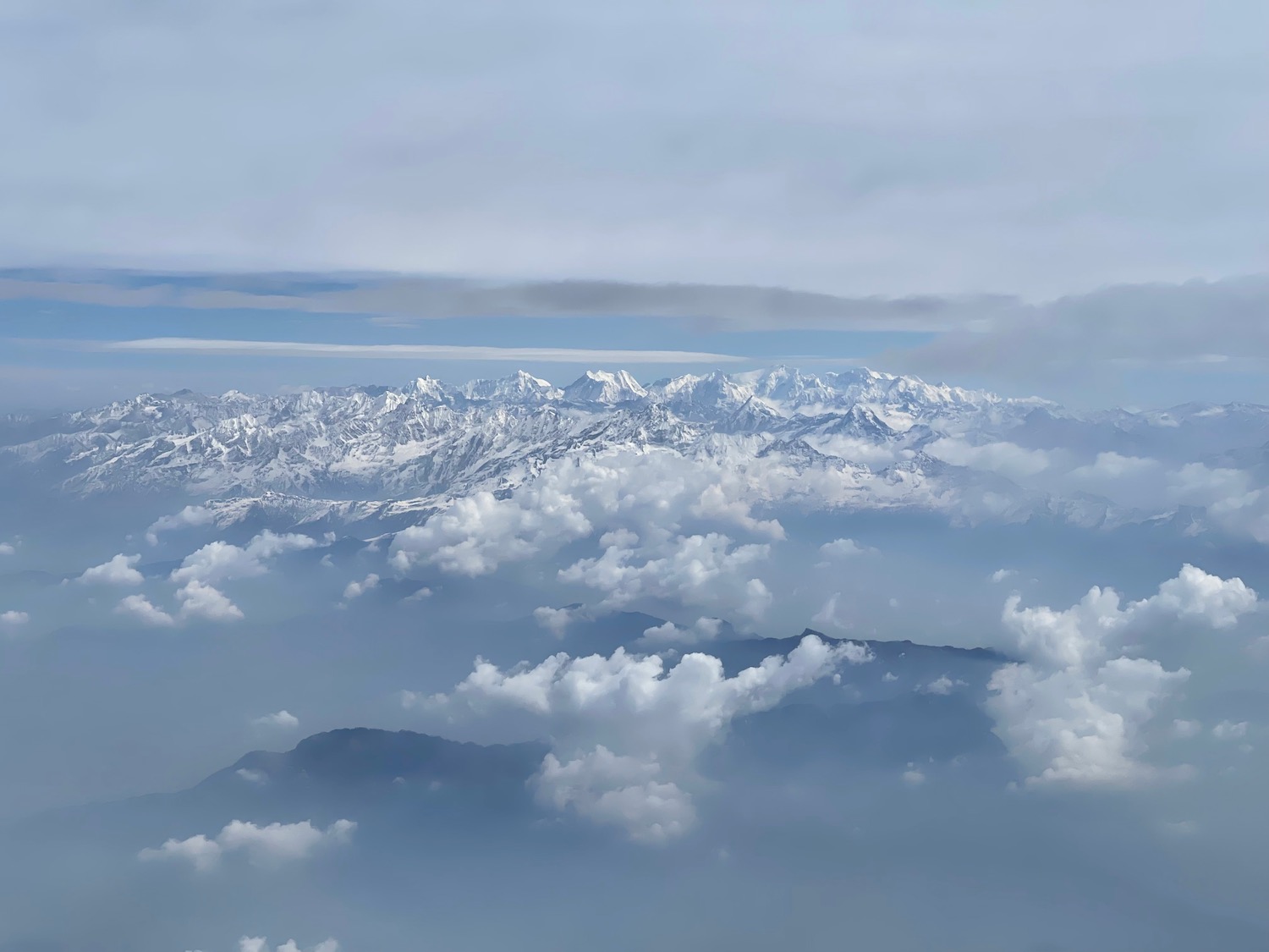 a mountain range with clouds