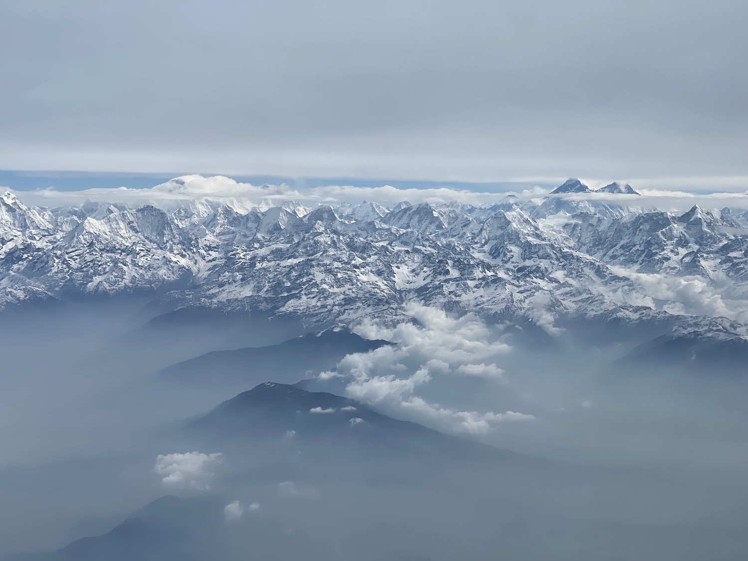 a mountain range with clouds