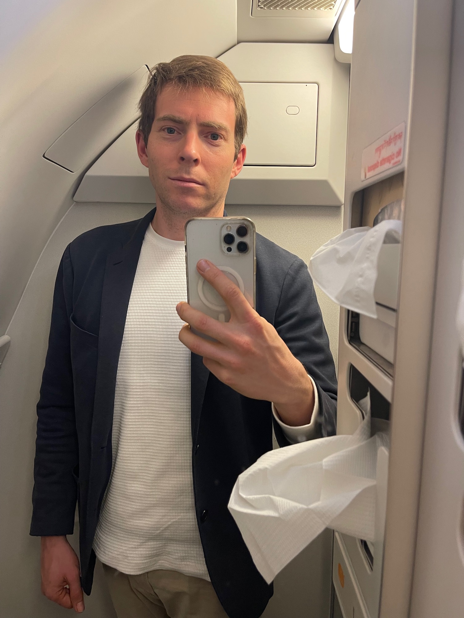 a man taking a selfie in an airplane