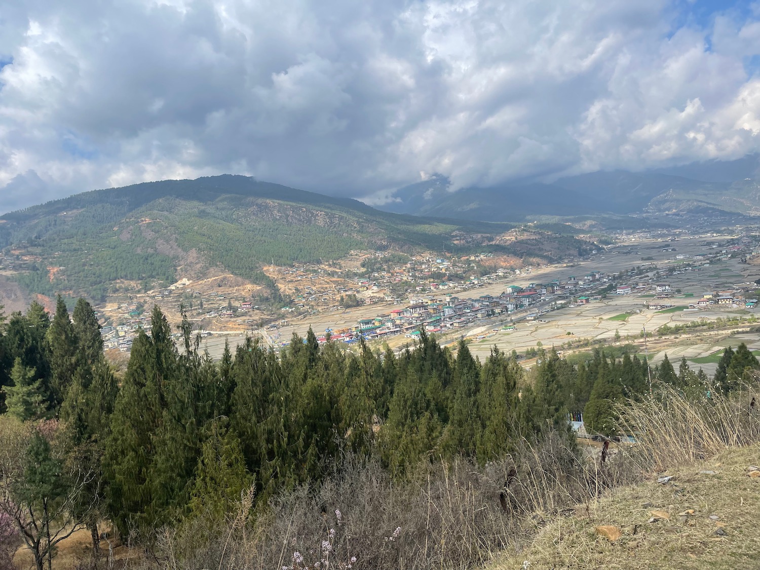 a landscape of a town and mountains