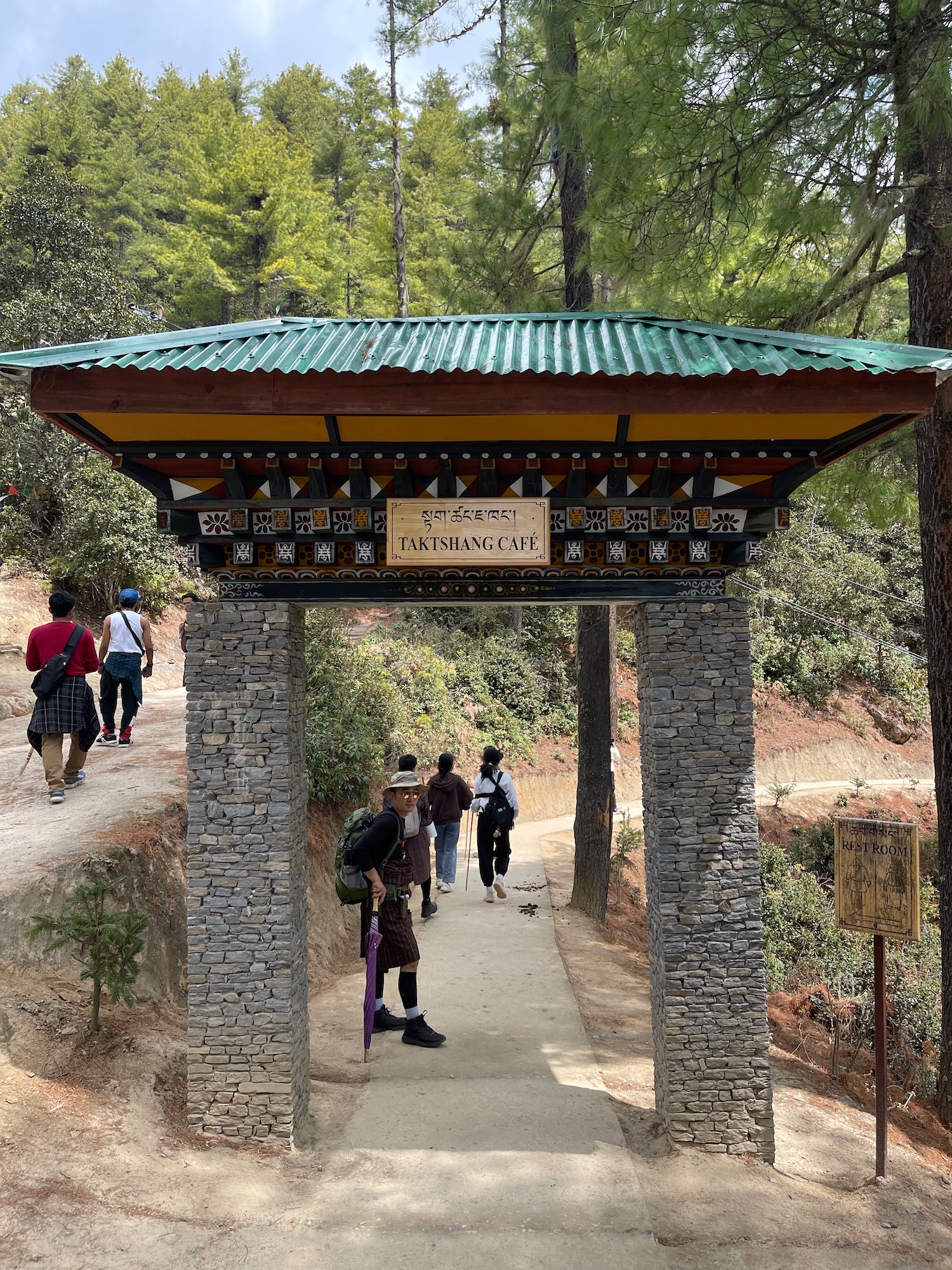 a group of people walking on a path