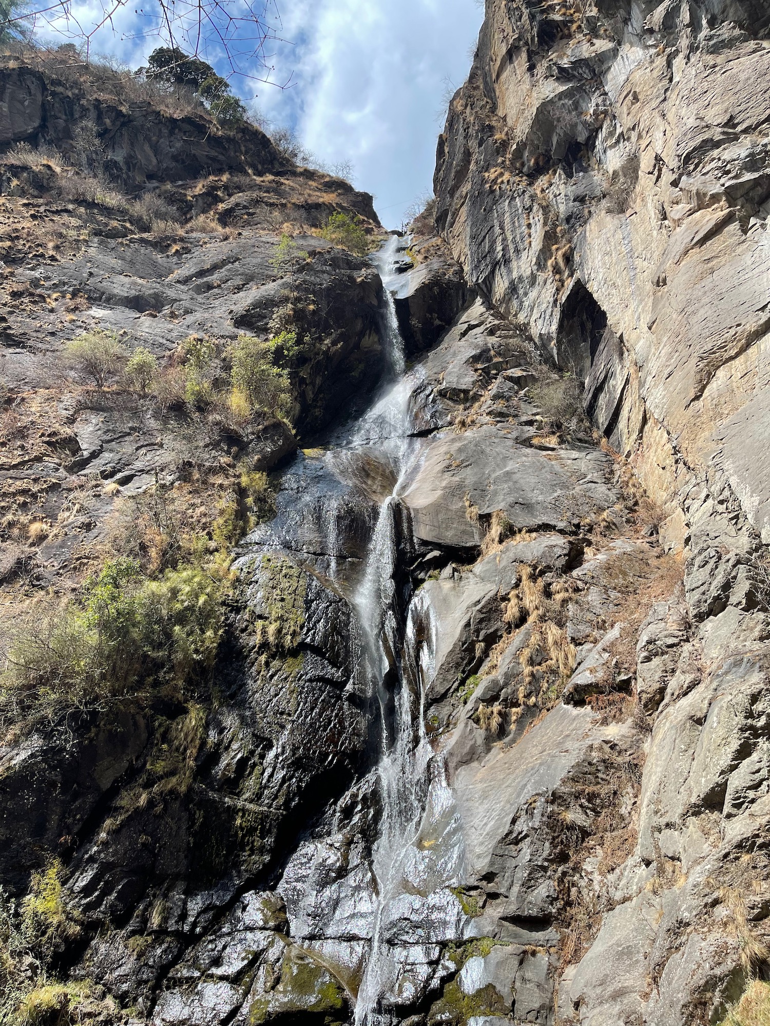 a waterfall on a rocky cliff