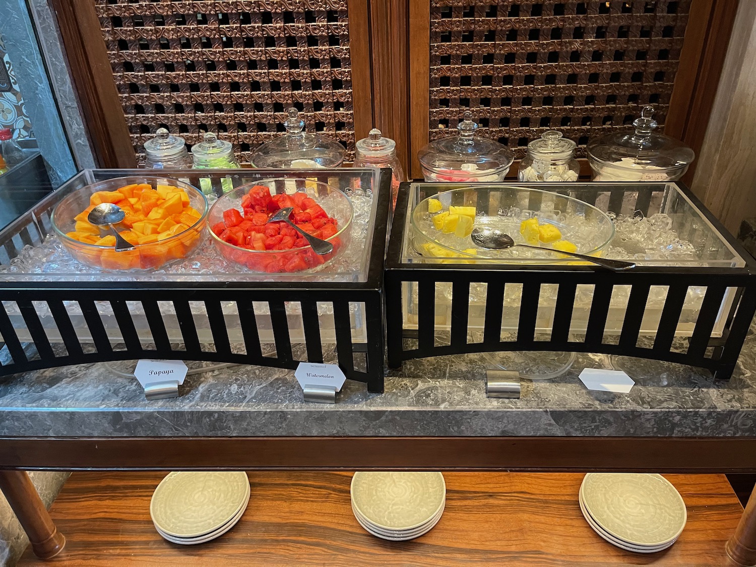 a buffet with fruit in bowls