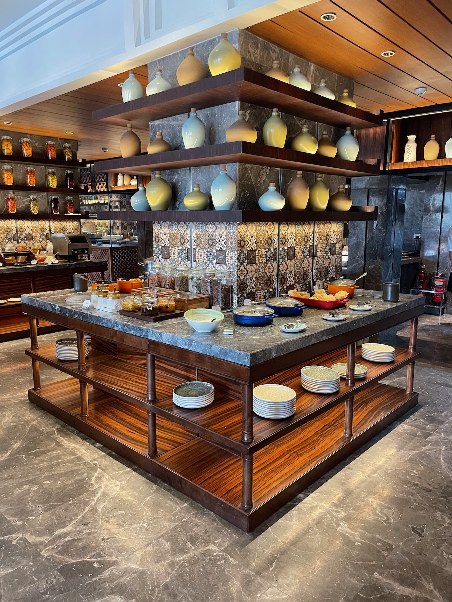 a kitchen with shelves and shelves of food