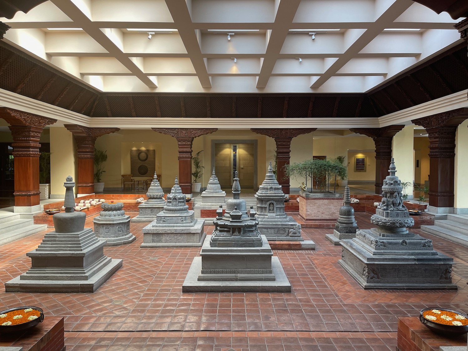 a large room with many small statues