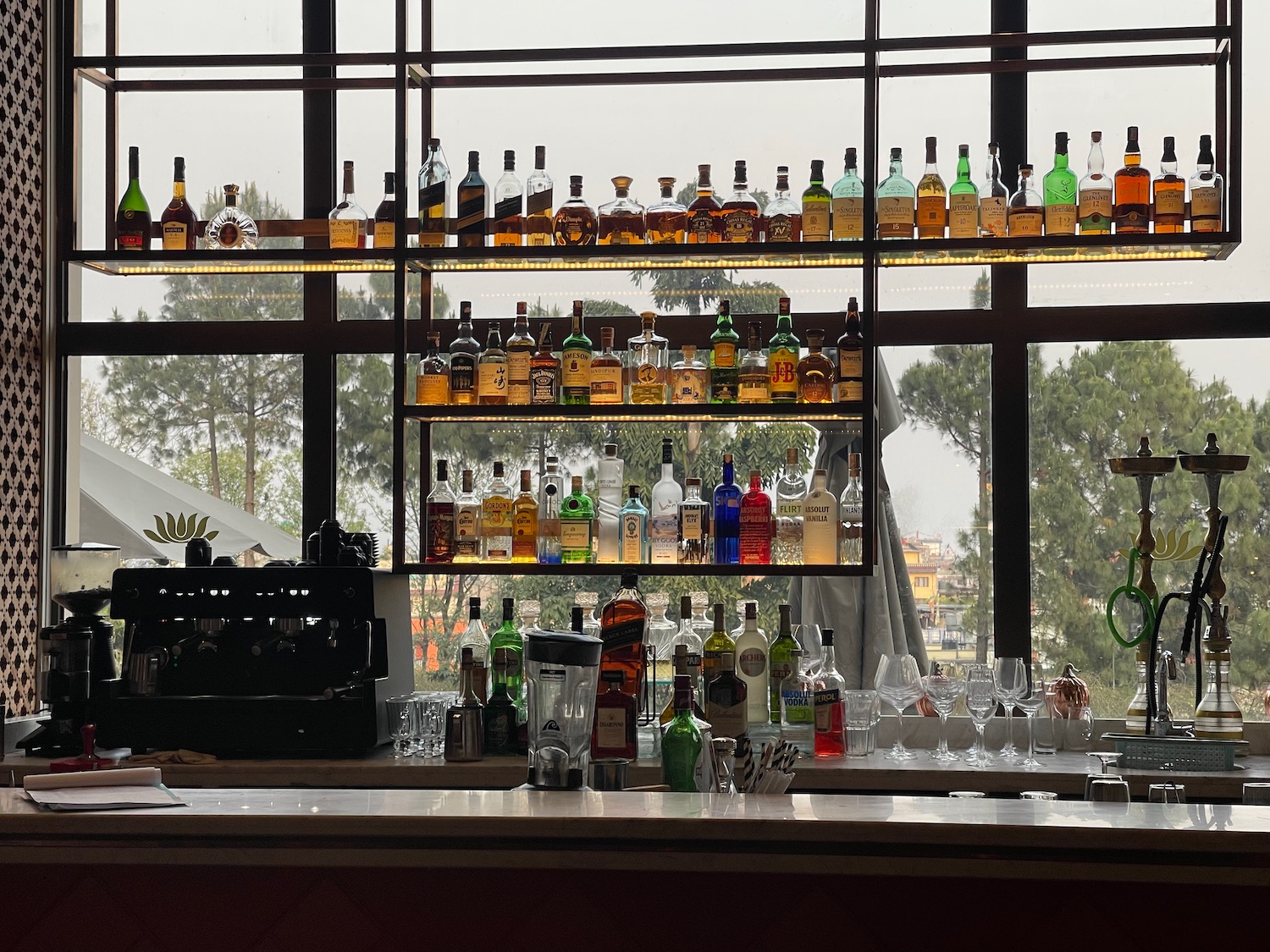 a shelf of liquor bottles