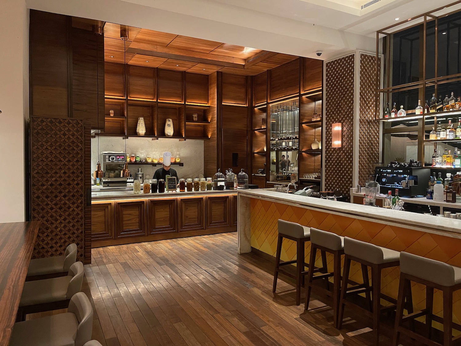 a bar with a counter and stools