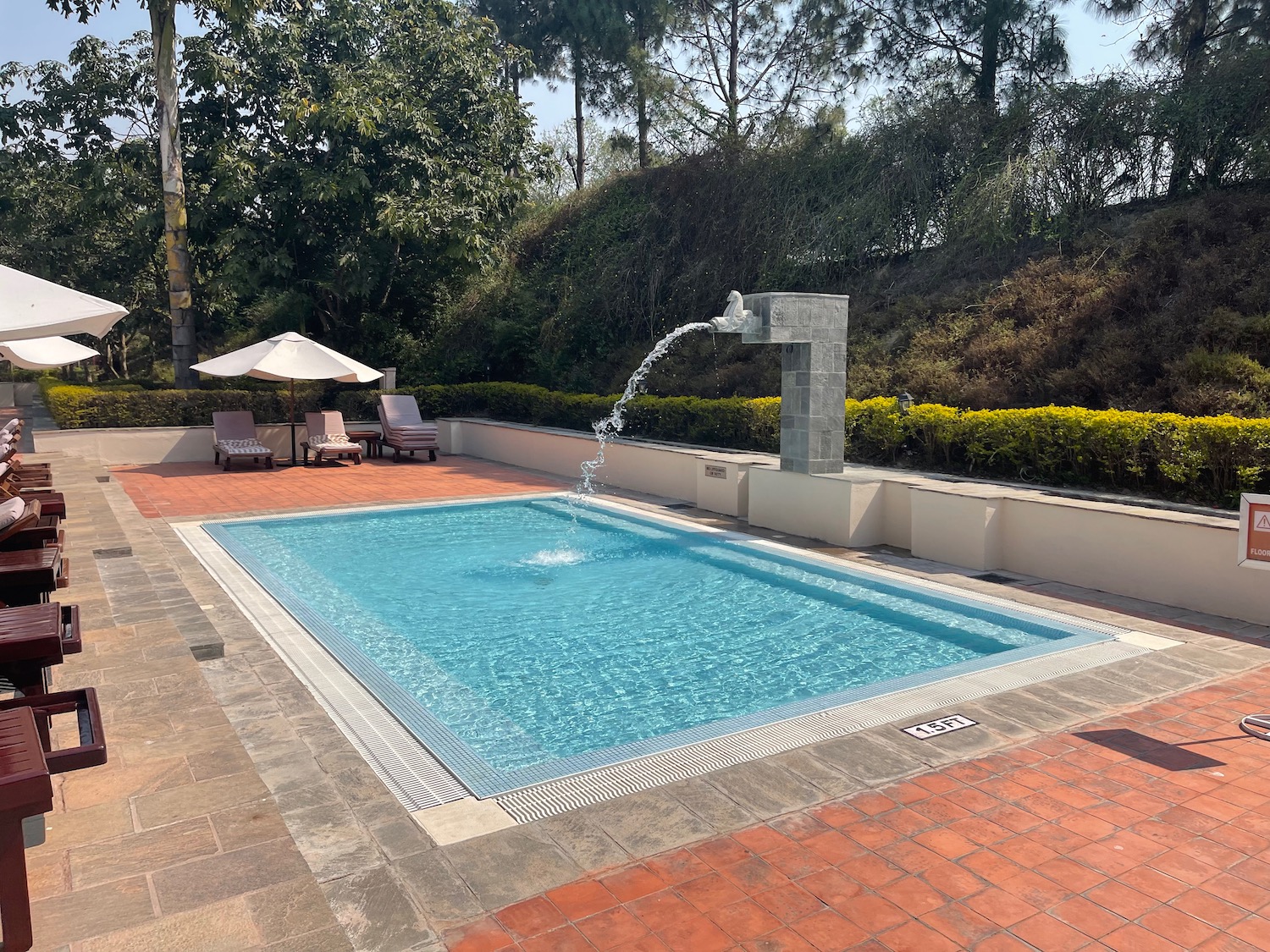 a pool with a fountain