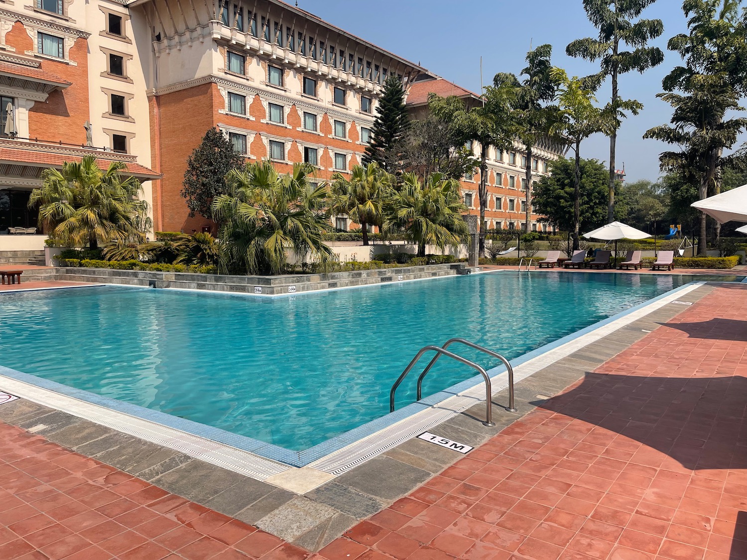 a pool with a building in the background