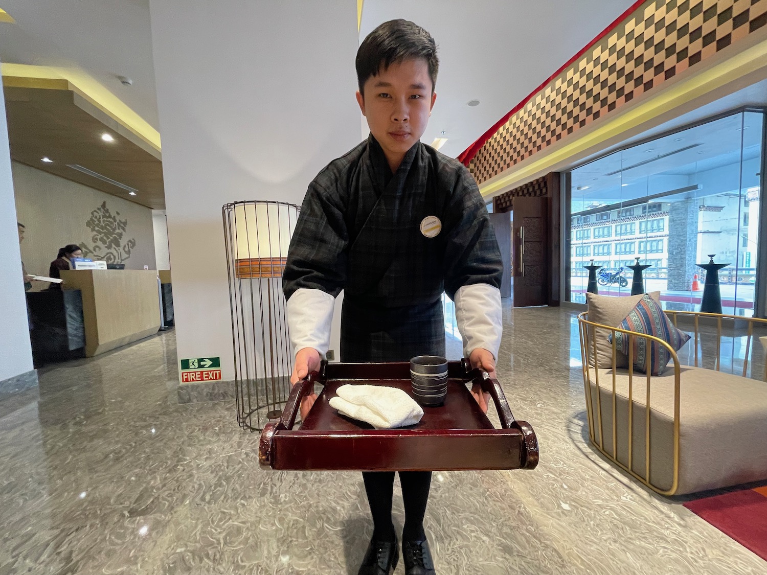 a boy holding a tray