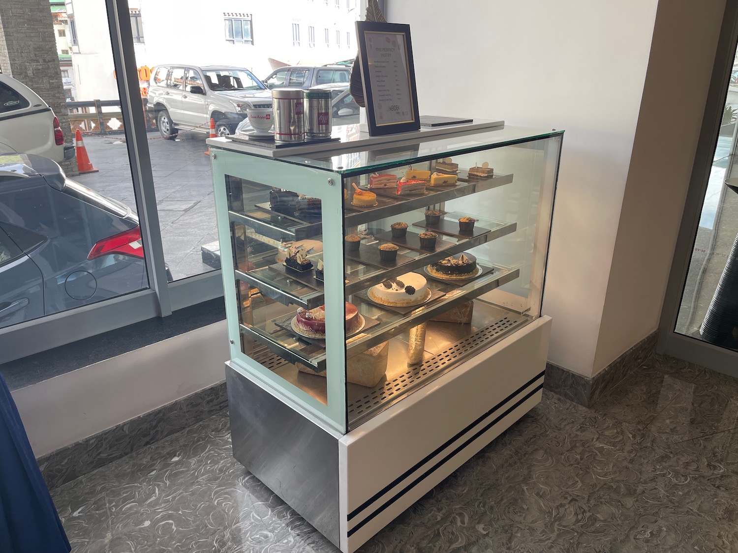 a glass case with food on it