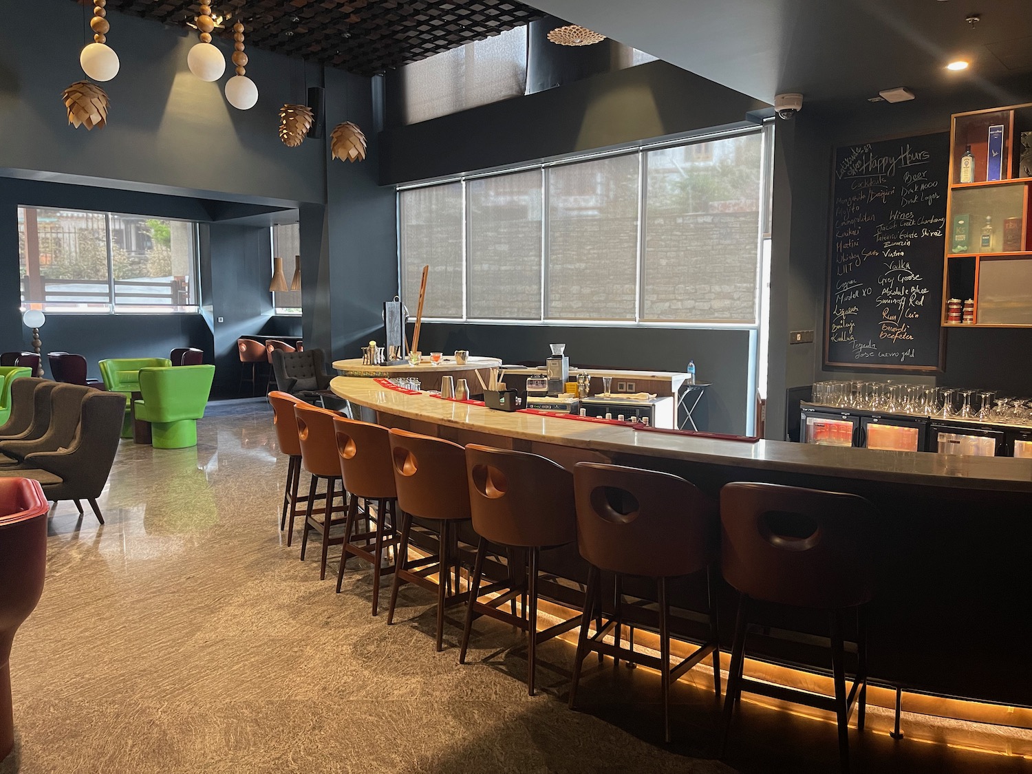 a bar with chairs in a room