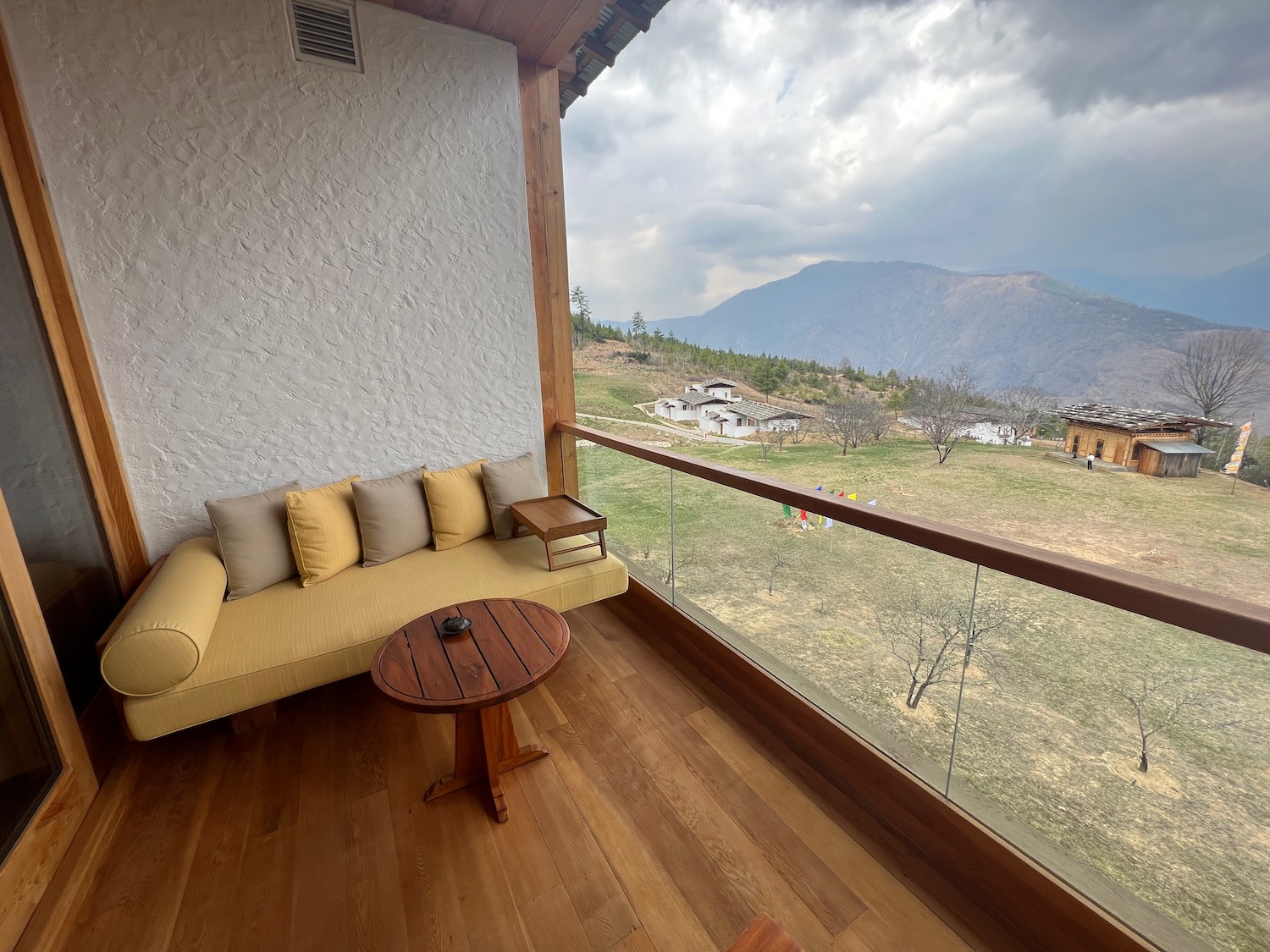 a couch and table on a balcony