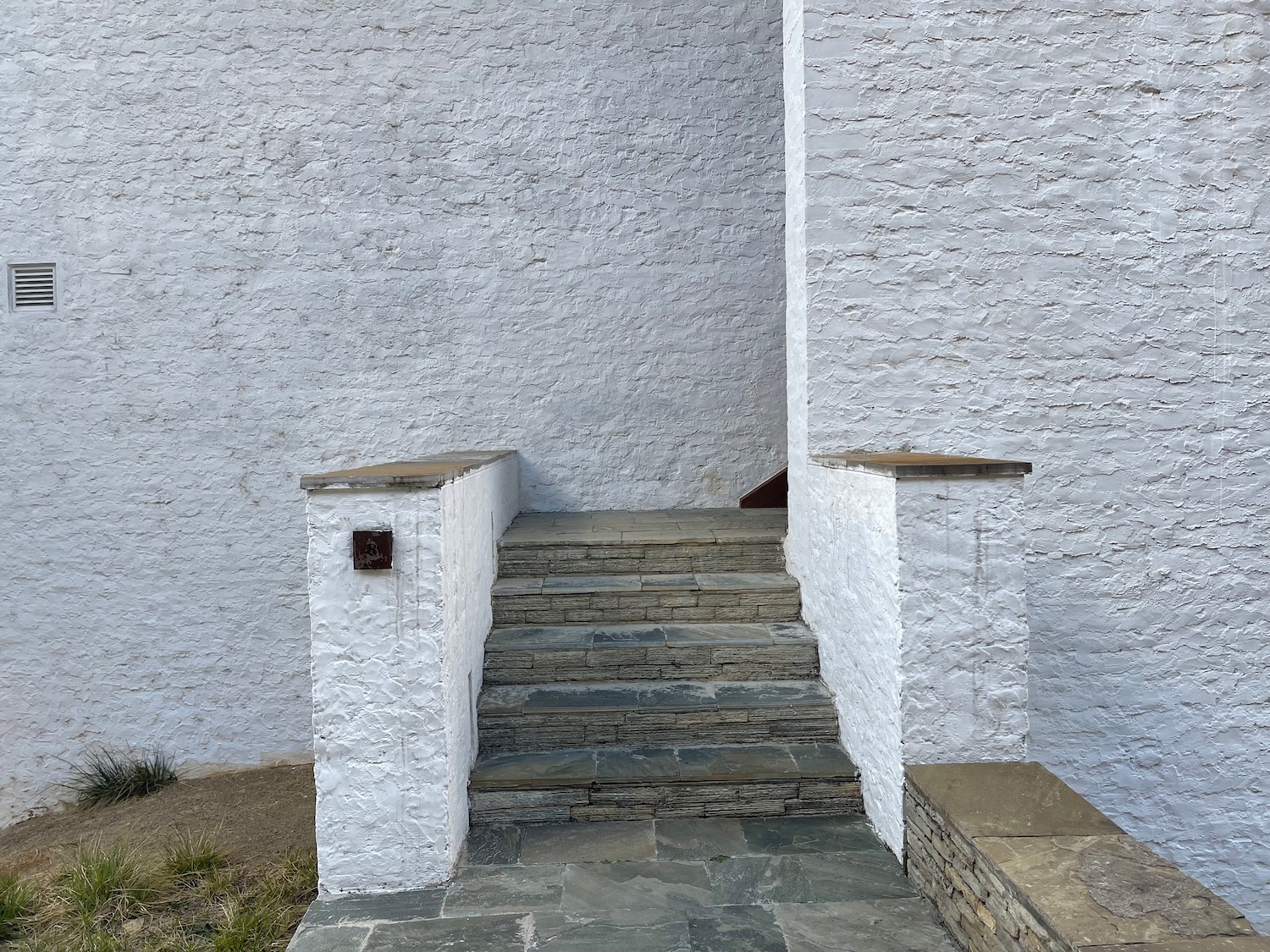 a stone stairs leading up to a building