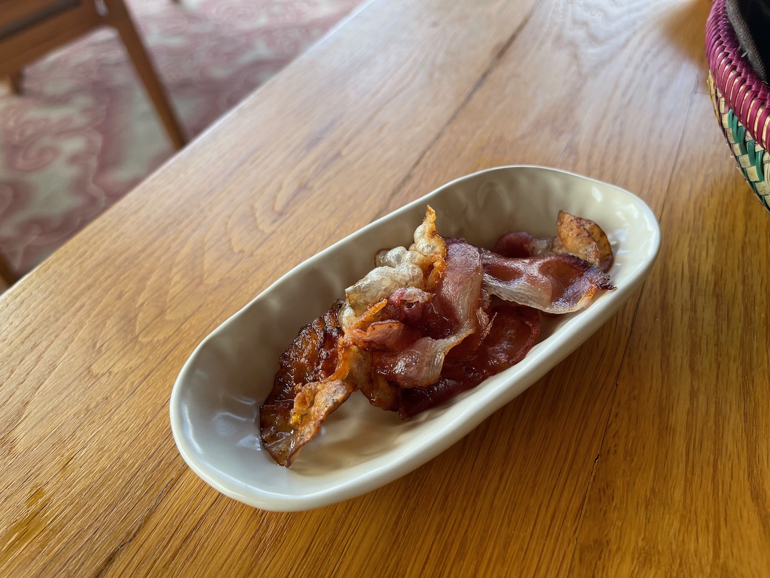 a plate of bacon on a table