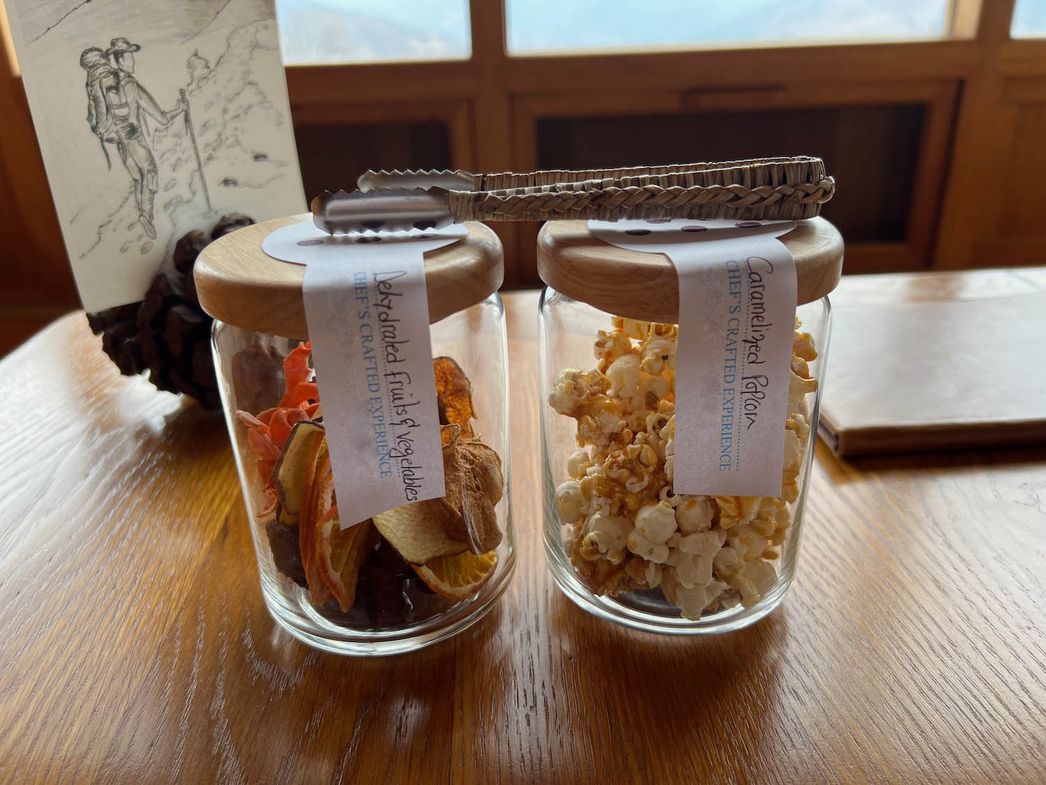 a couple of glass jars with food on top