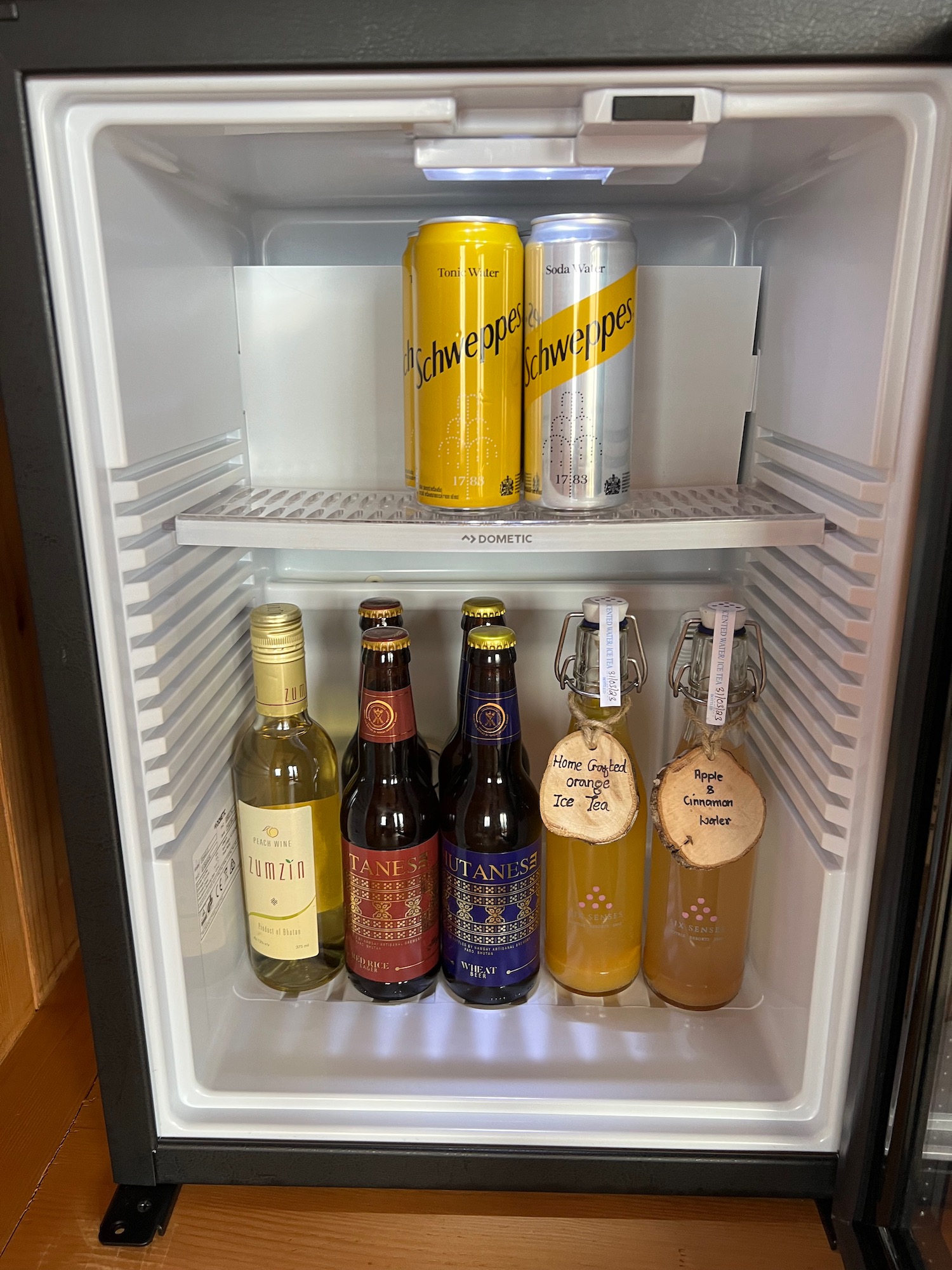 a refrigerator with bottles of beer