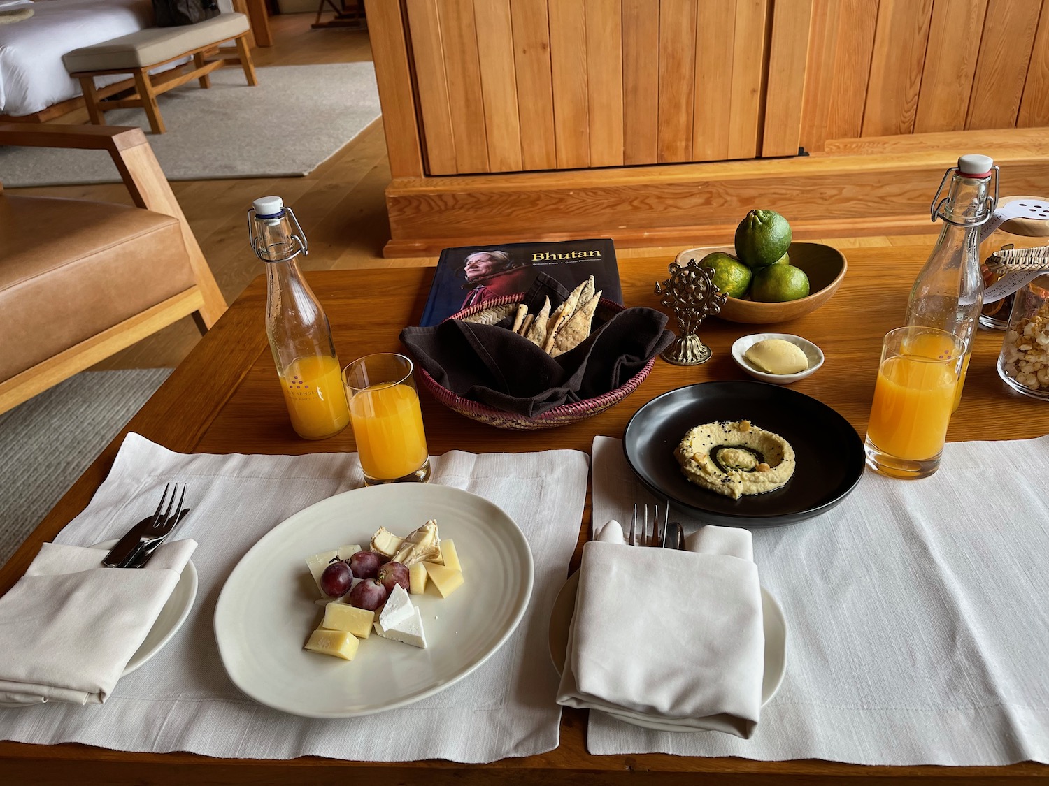 a table with plates of food and drinks