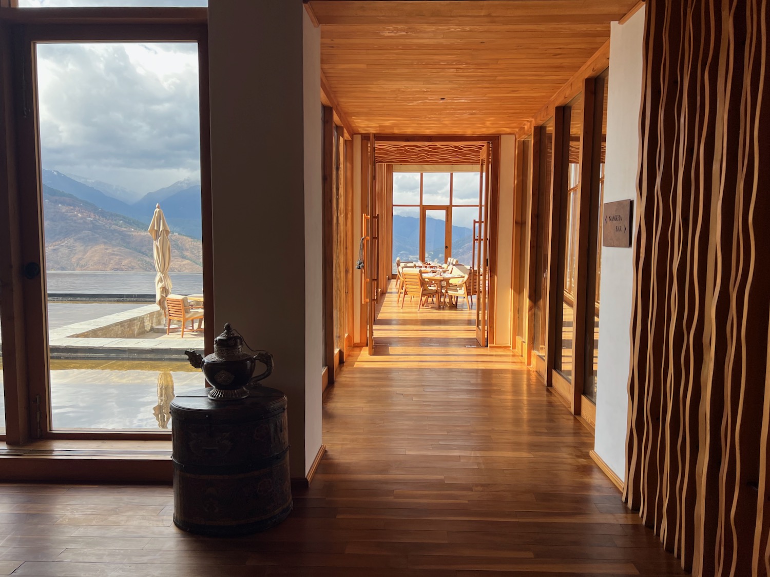 a room with a wood floor and a large window