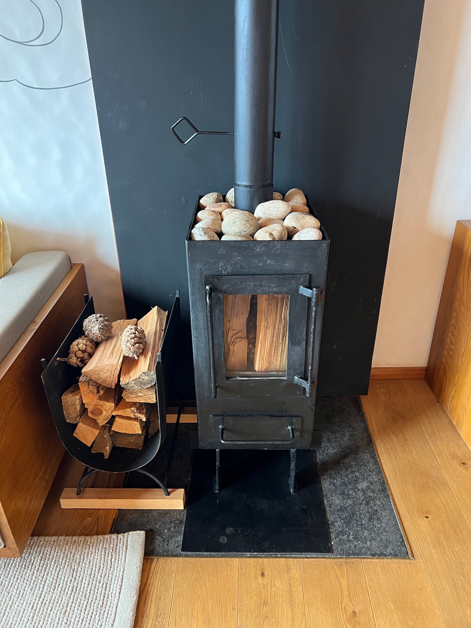 a wood stove with wood logs in it