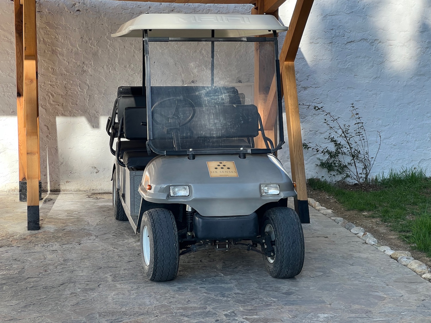 a golf cart parked under a roof