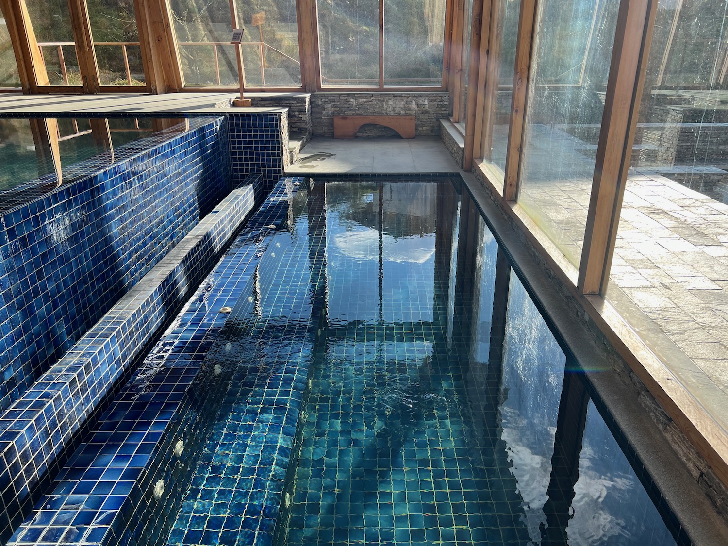 a indoor pool with blue tiles