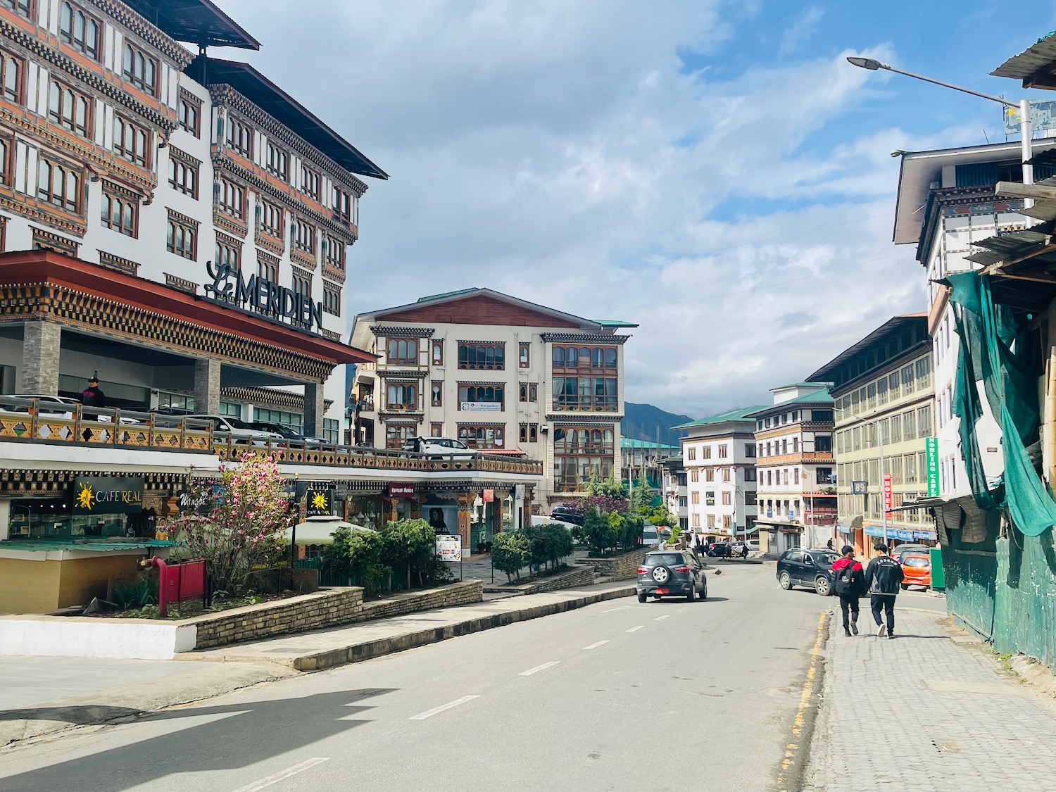 a street with buildings and cars