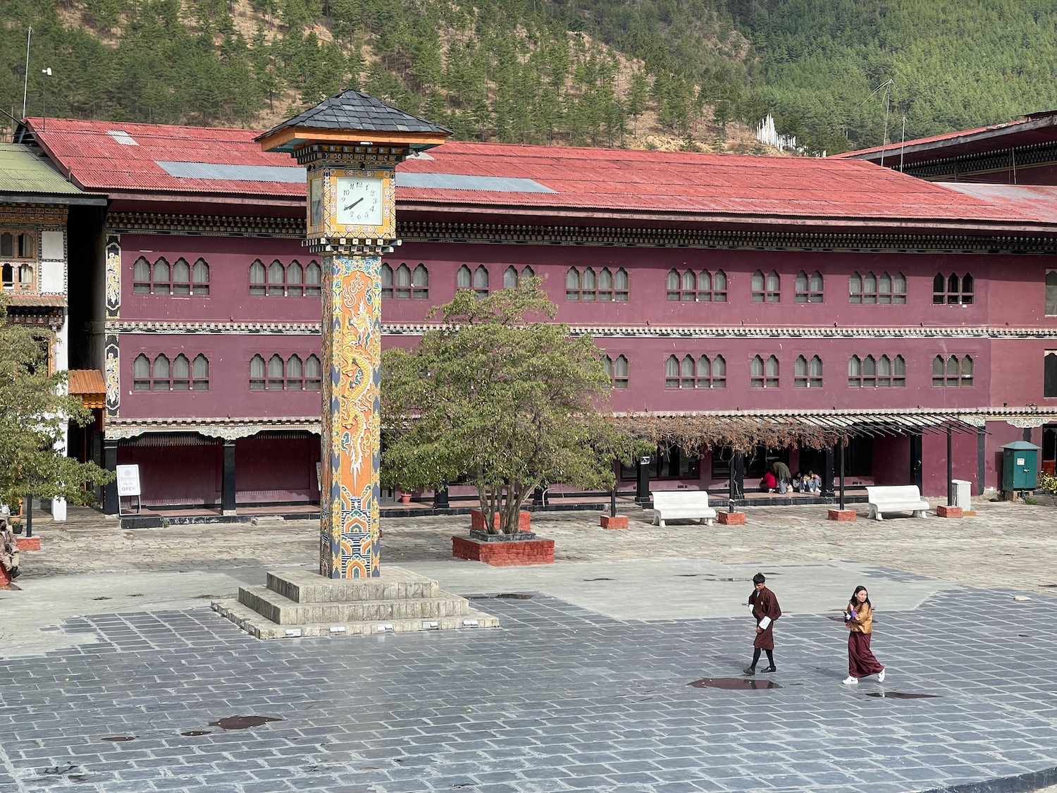 a clock tower in front of a building