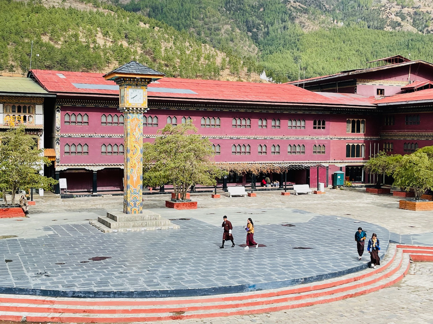 a group of people walking in a courtyard