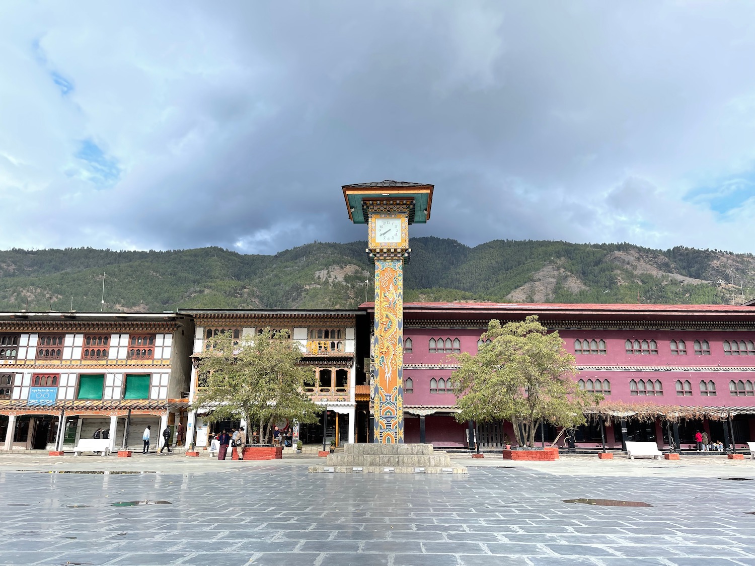 a clock tower in front of buildings