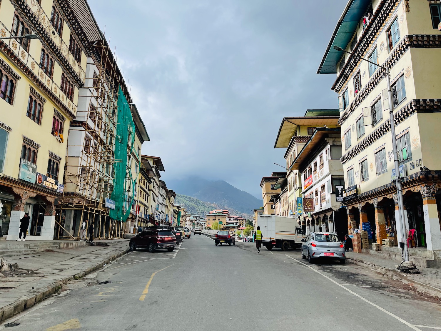 a street with cars and buildings