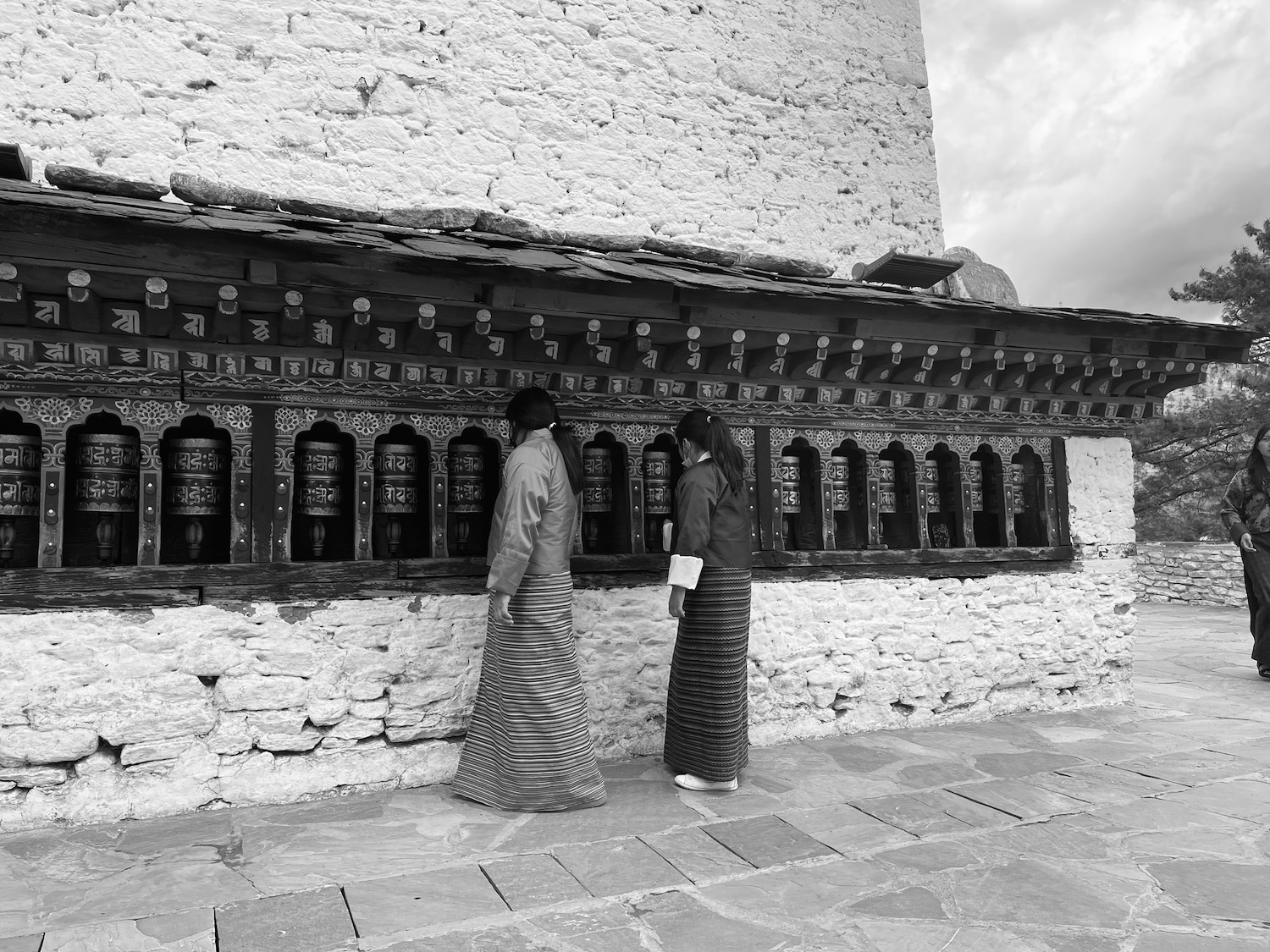 two people standing in front of a building