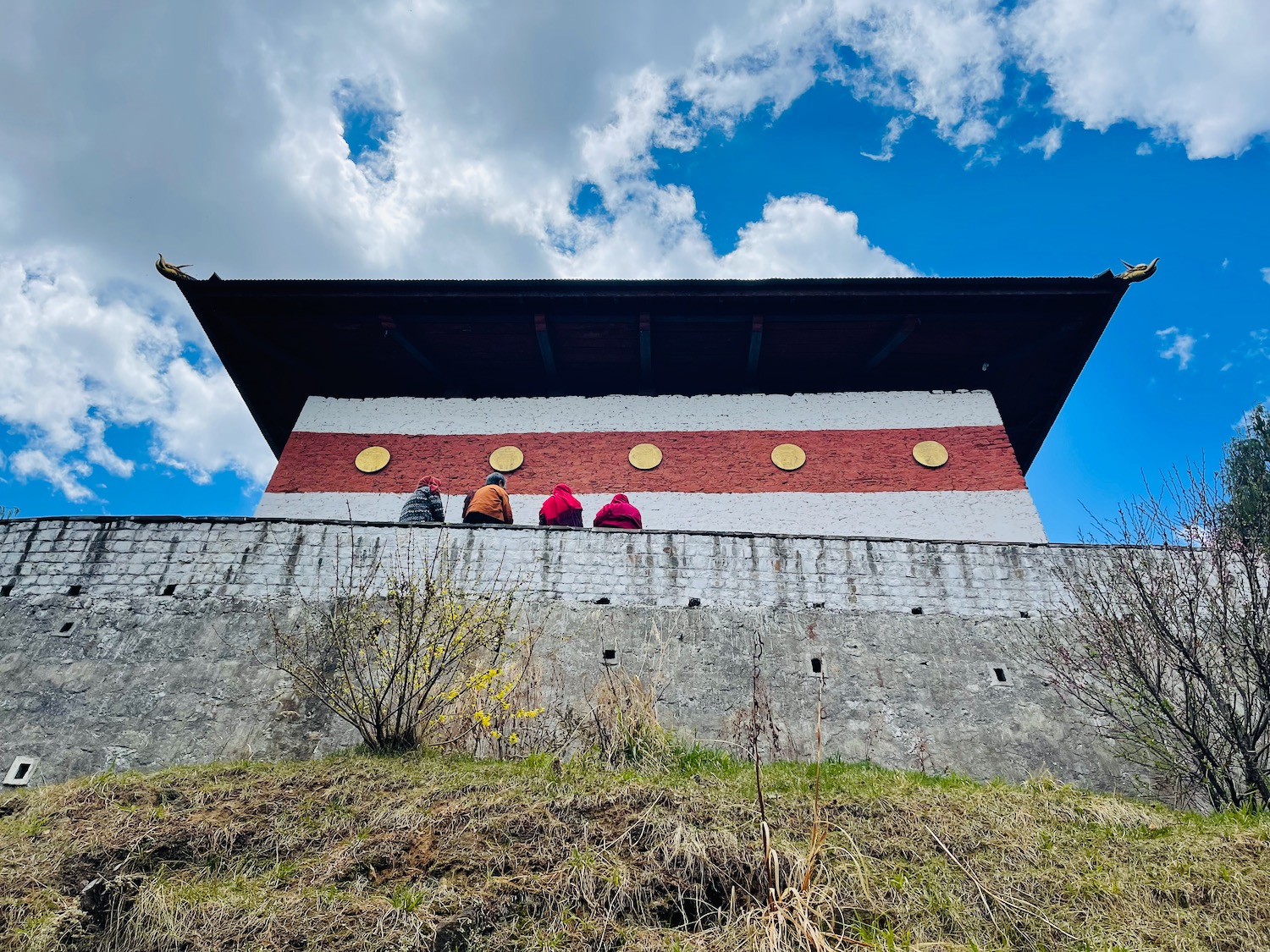 a group of people standing on a wall