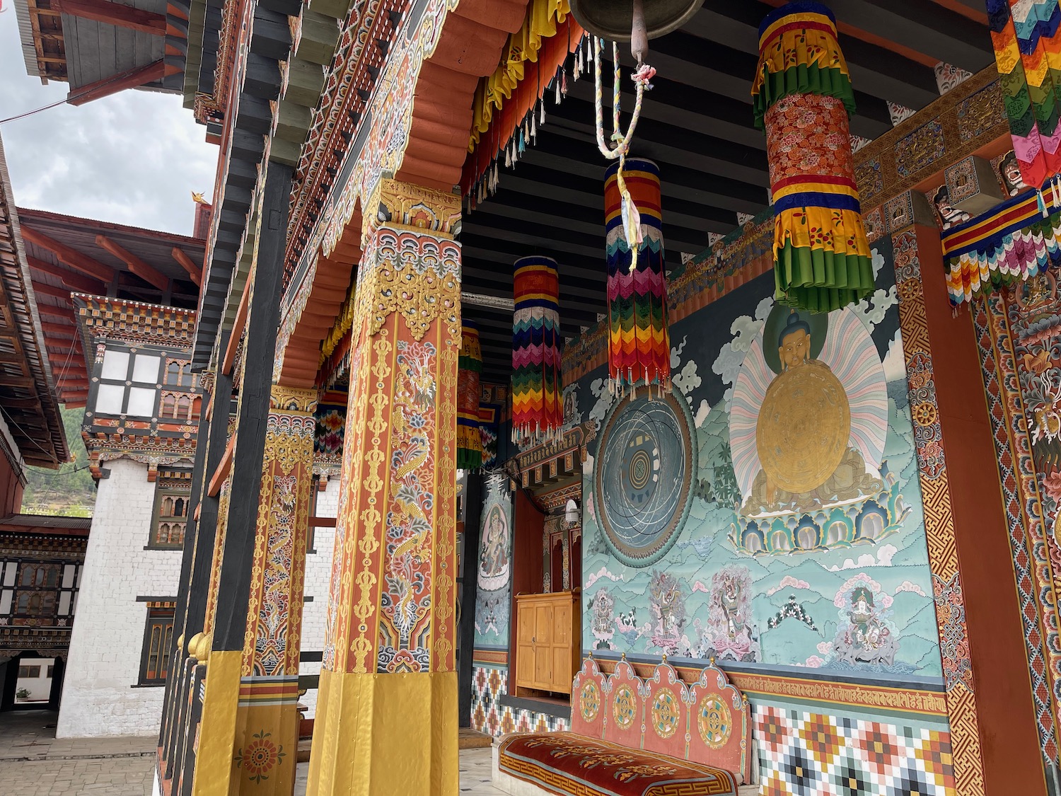 a colorful decorated building with a bell