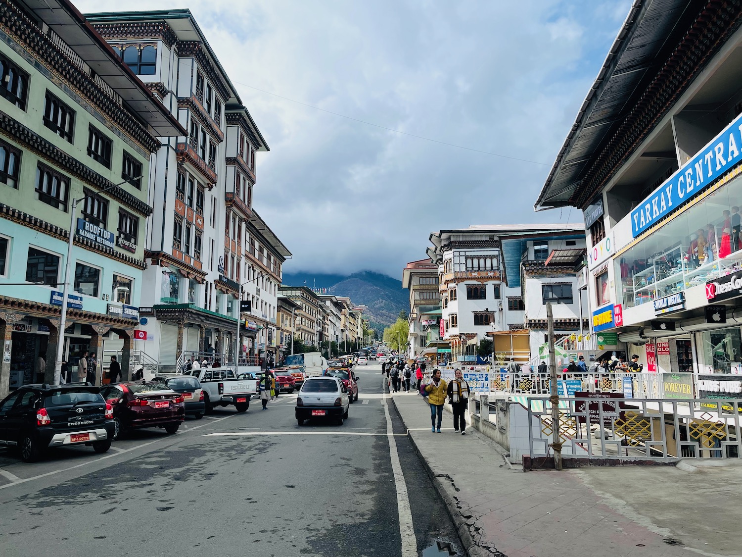 a street with cars and buildings