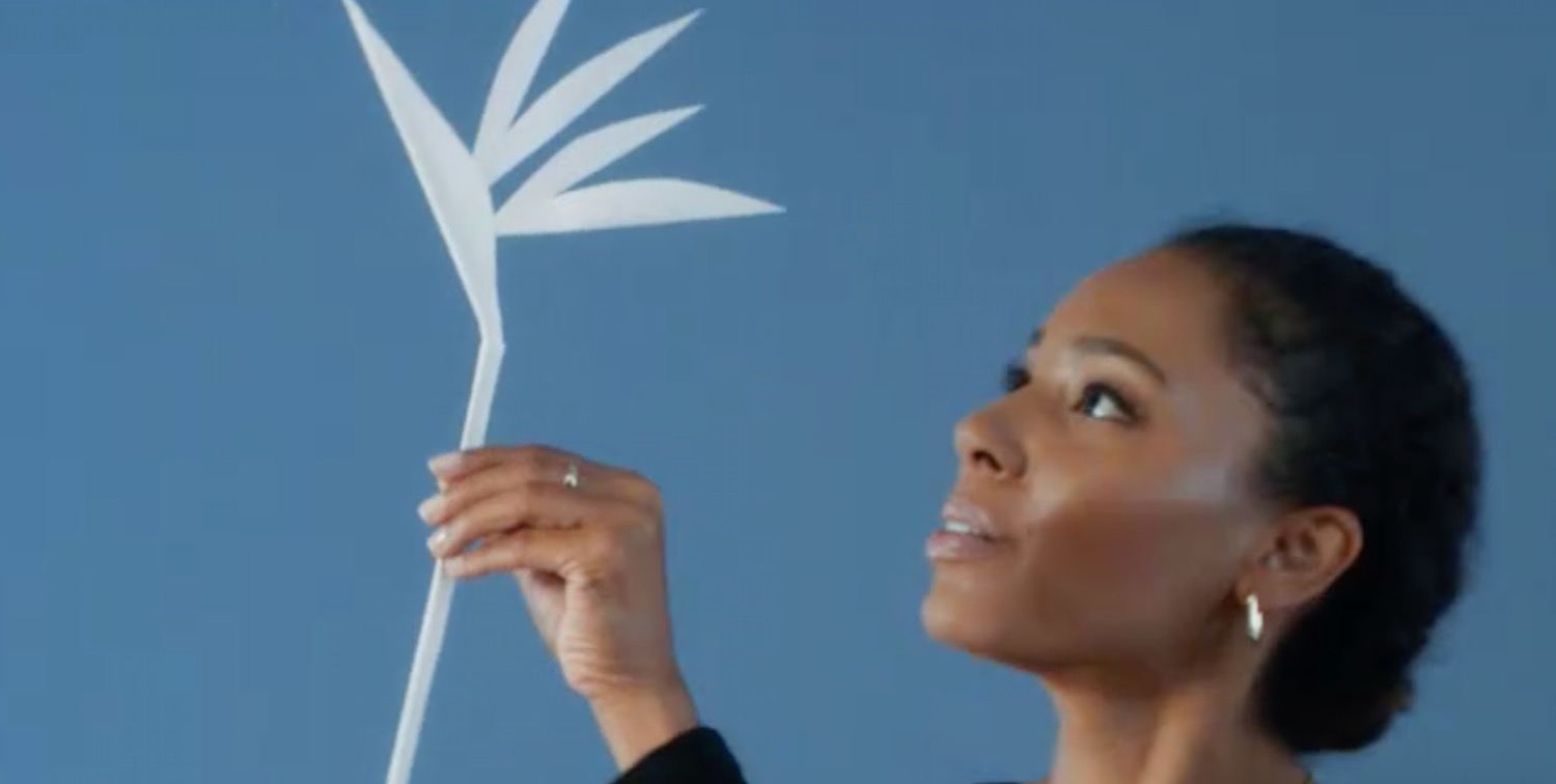 a woman holding a white object