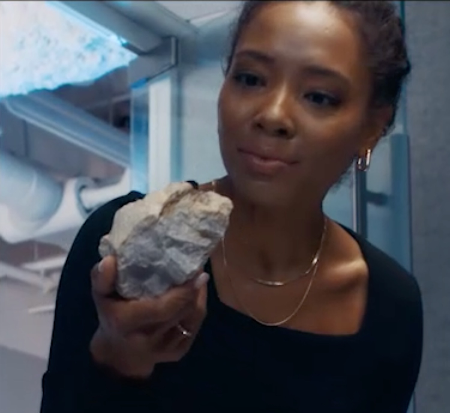 a woman holding a rock