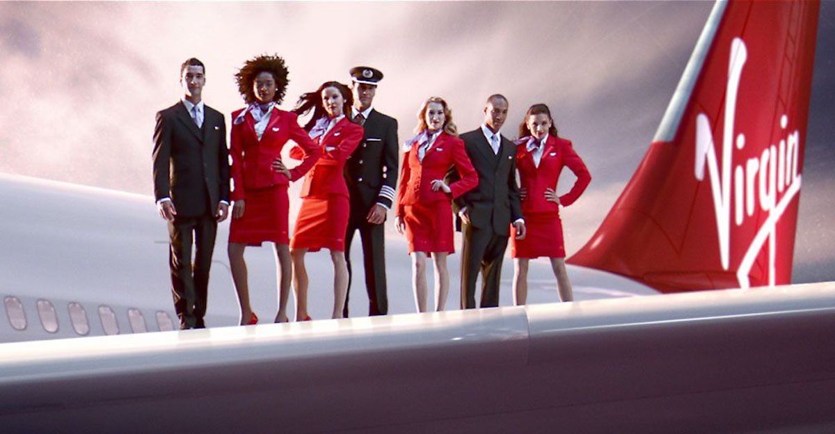 a group of people standing on a plane