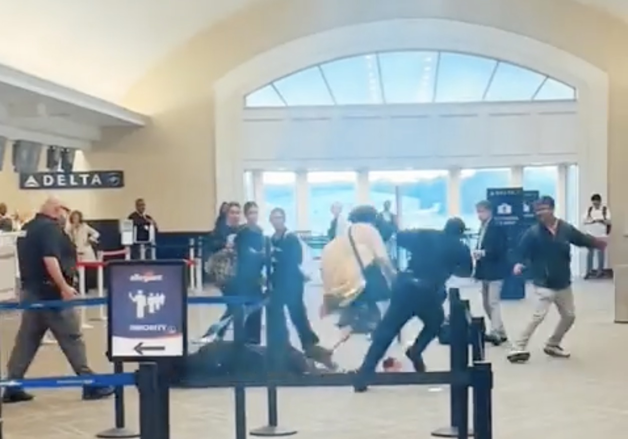 people walking around in an airport