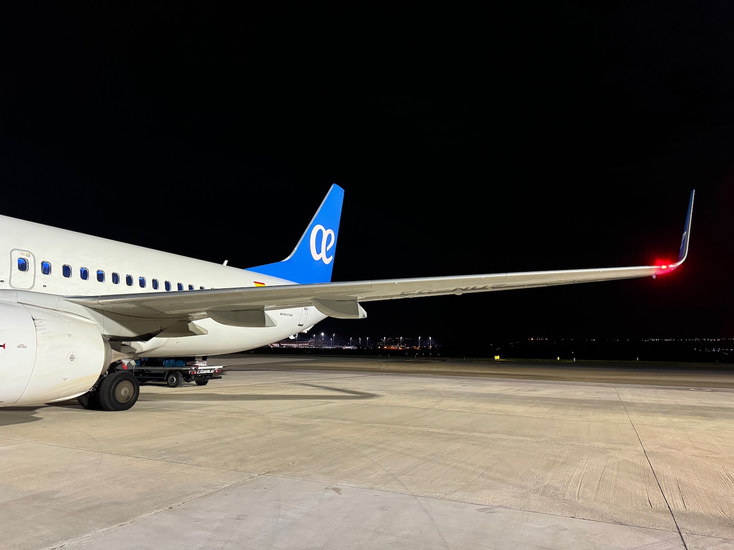 a plane on the runway at night