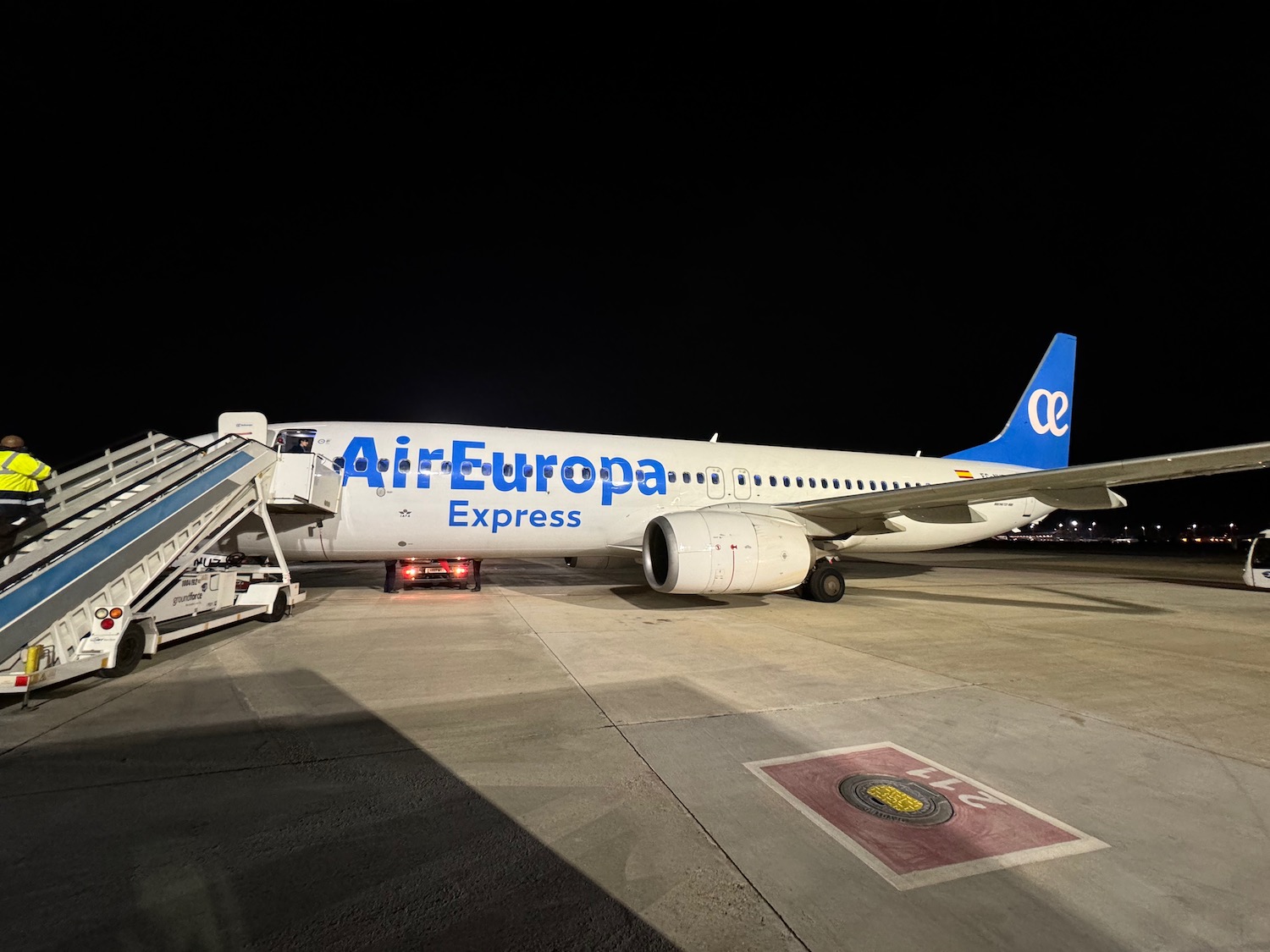 a plane on the runway at night