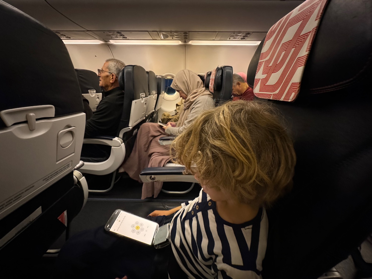 a child sitting in an airplane