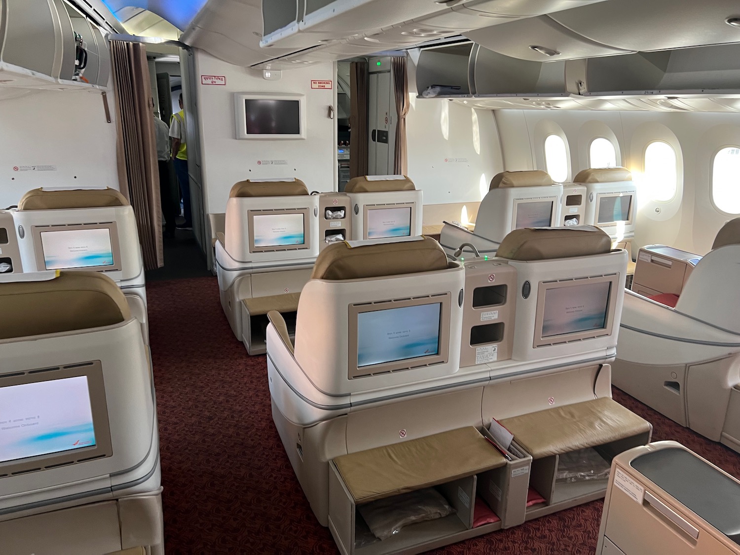 a plane with rows of seats and a few windows