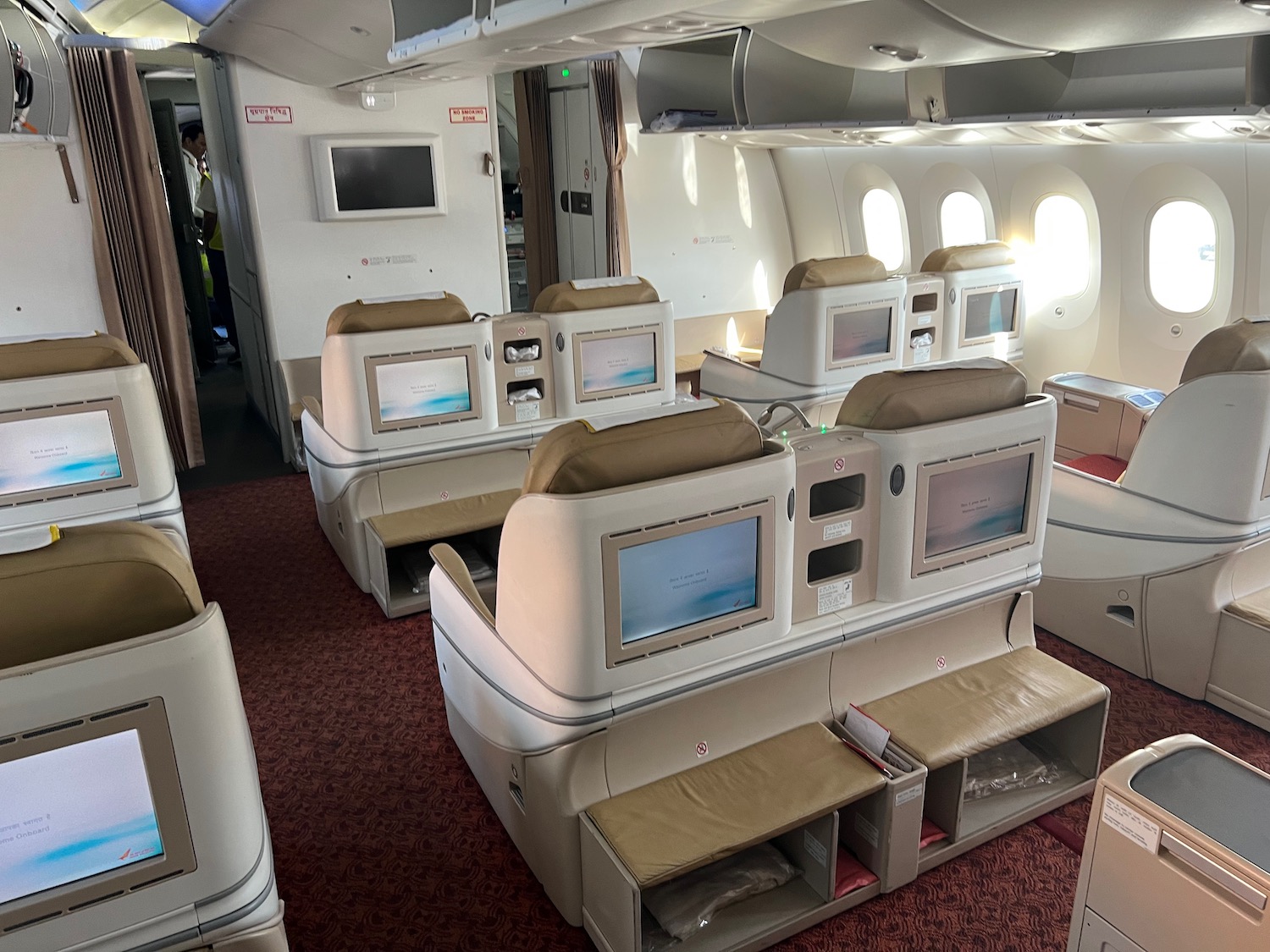 a plane with seats and monitors
