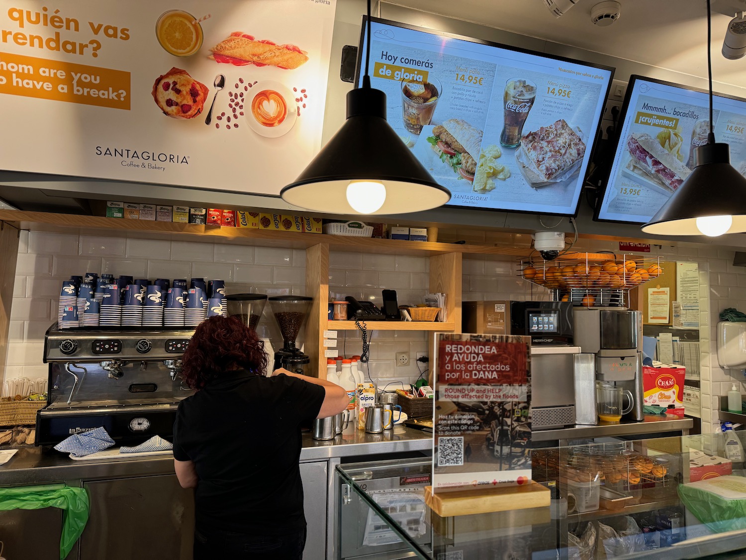 a woman standing in front of a counter