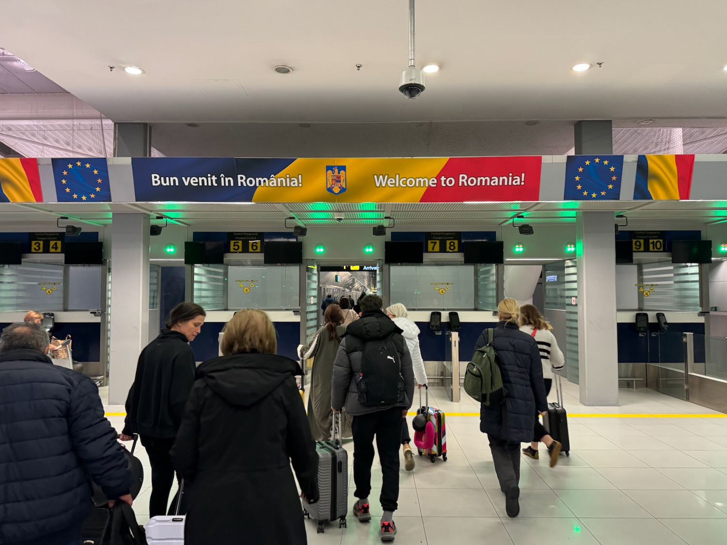 people walking through an airport